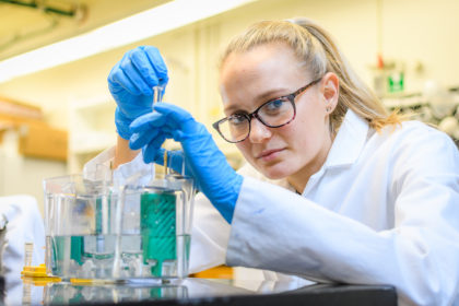 Rylee Simons holding test tubes