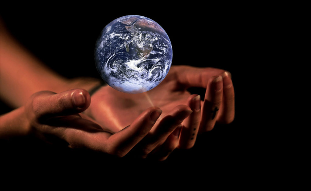 Hands holding Earth