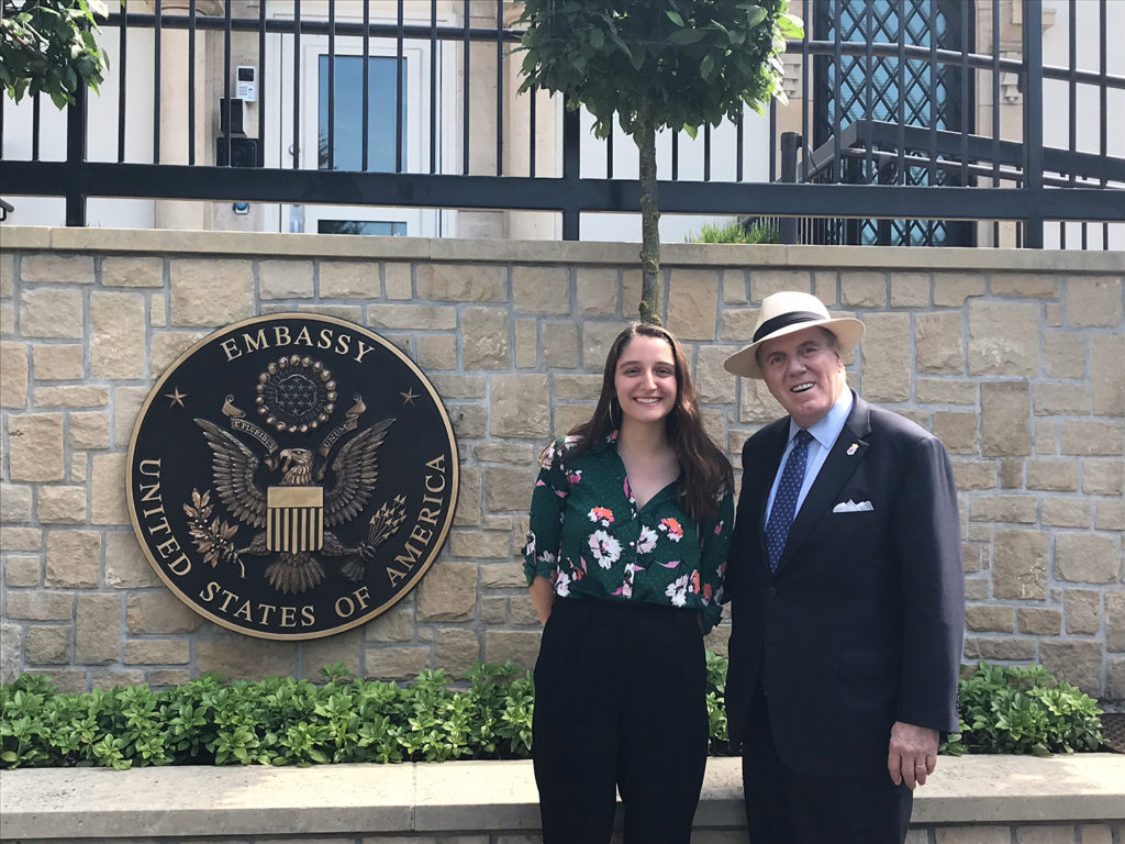 Juliet Michaelsen and U.S. Ambassador J. Randoloph Evans outside the U.S. embassy in Luxembourg.