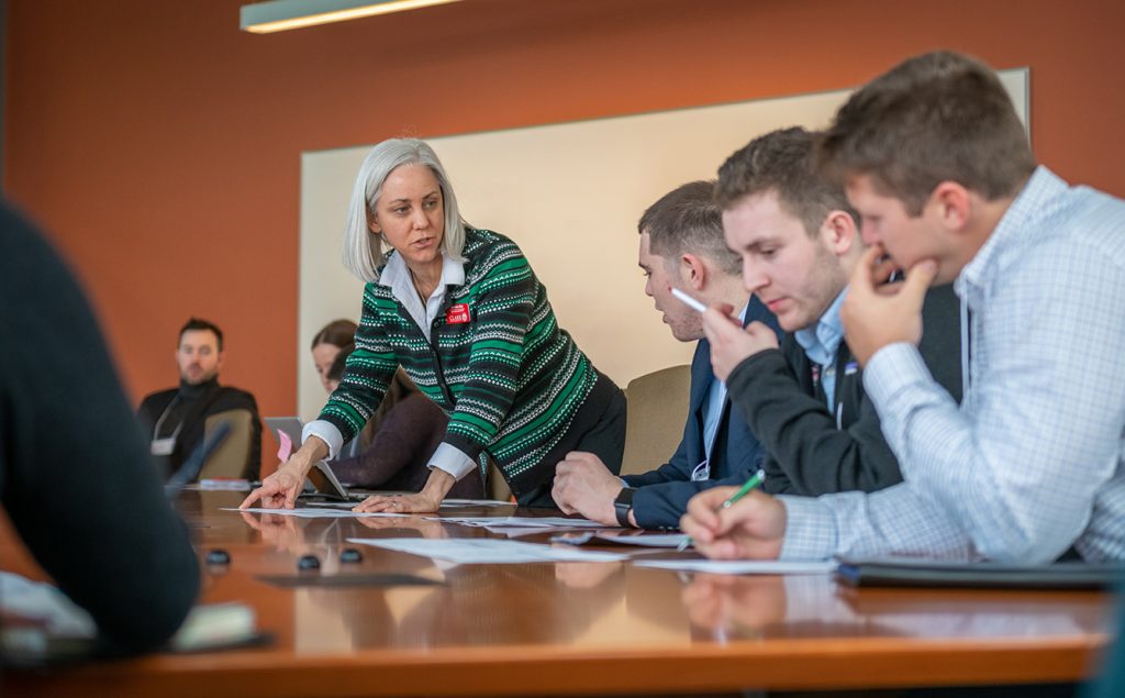 Michelle Flint, career development director, works with student-athletes during Practice Your Pitch.