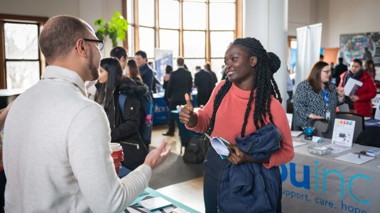 Student talking to industry representative