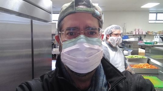 Ramón Borges-Méndez in mask to prepare meals for Worcester schools nutrition program