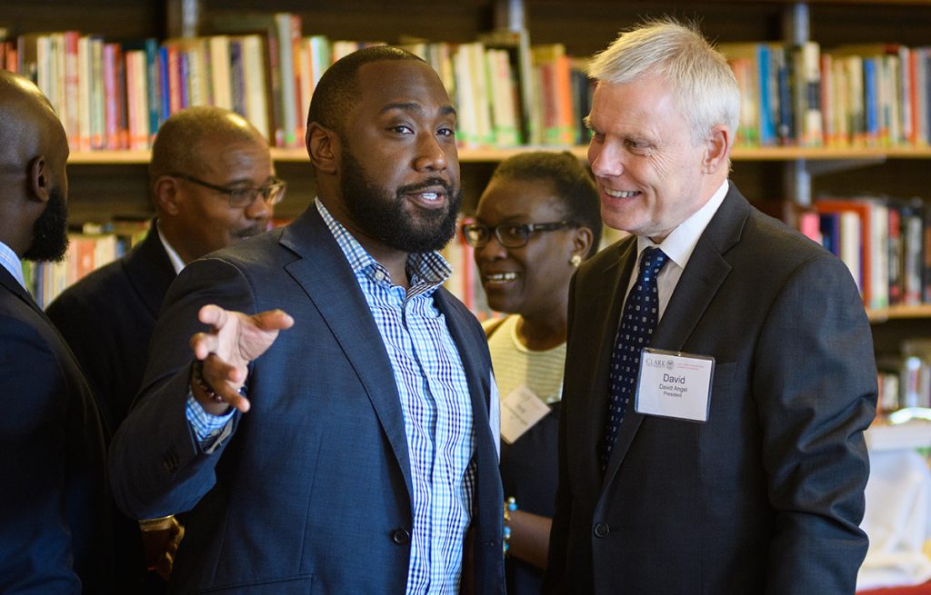 David Angel speaks with Justin Bailey at a Clark event