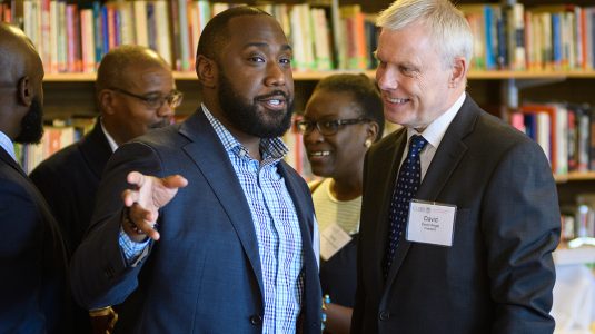 David Angel speaks with Justin Bailey at a Clark event