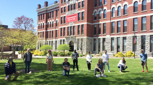 Clark Labs student researchers socially distance on the green