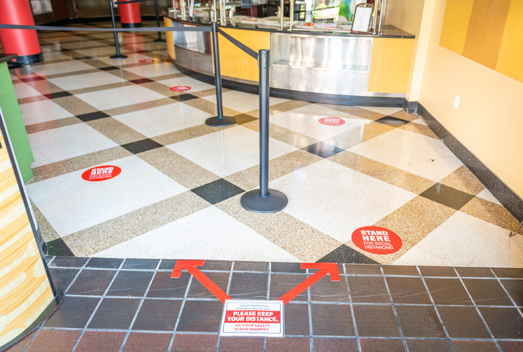 Clark University dining hall directional signs on floor