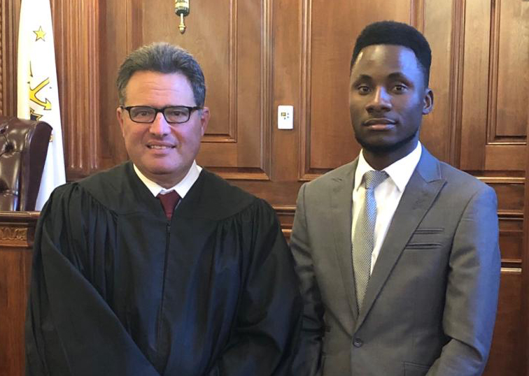 R.I. Superior Court Associate Justice Brian Stern with Emanuel Sapalo '21