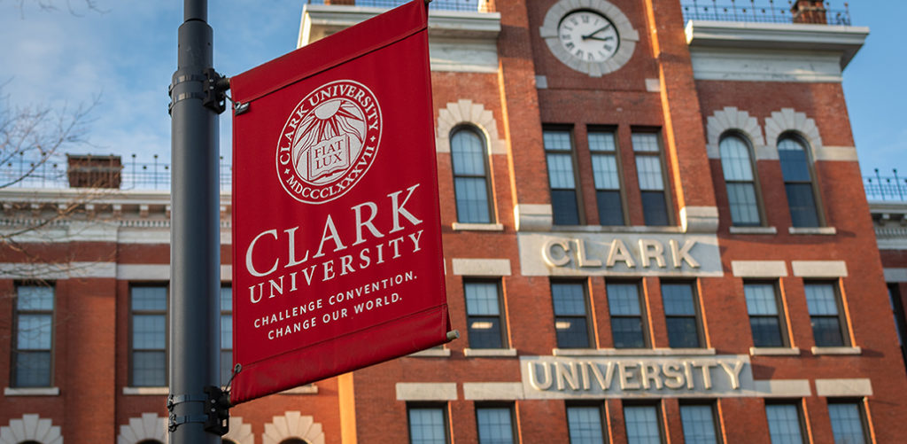 Jonas Clark Hall with Clark University banner in foreground