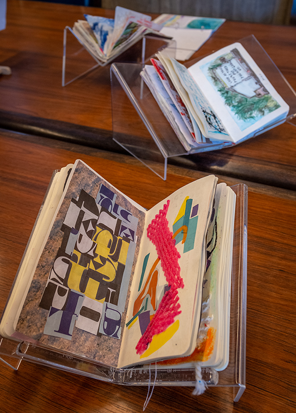 Sketchbooks by Clark University students on display in the Goddard Library Rare Book Room