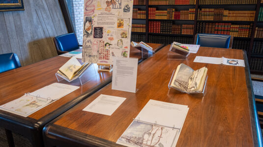 Sketchbooks by Clark University students on display in the Goddard Library Rare Book Room