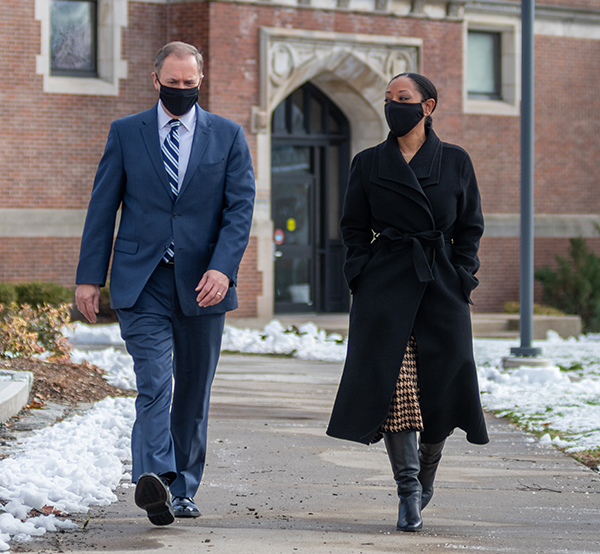 David Fithian walks on campus with Esther Jones, dean of the faculty