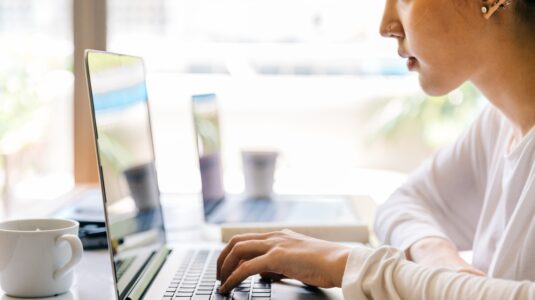 woman works at laptop