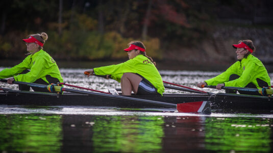 Members of the Clark women's rowing team practice during an early-morning session on Lake Quinsigamond.