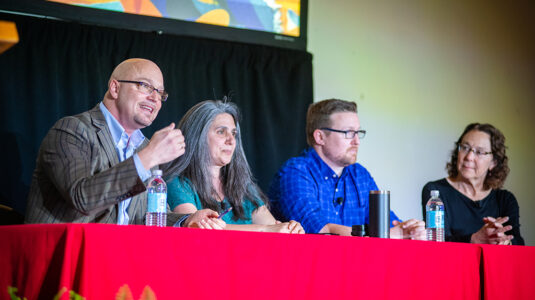 Professors Eric DeMeulenaere, Laurie Ross, Donald Spratt, and Shelly Tenenbaum discuss Clark's work in the community.