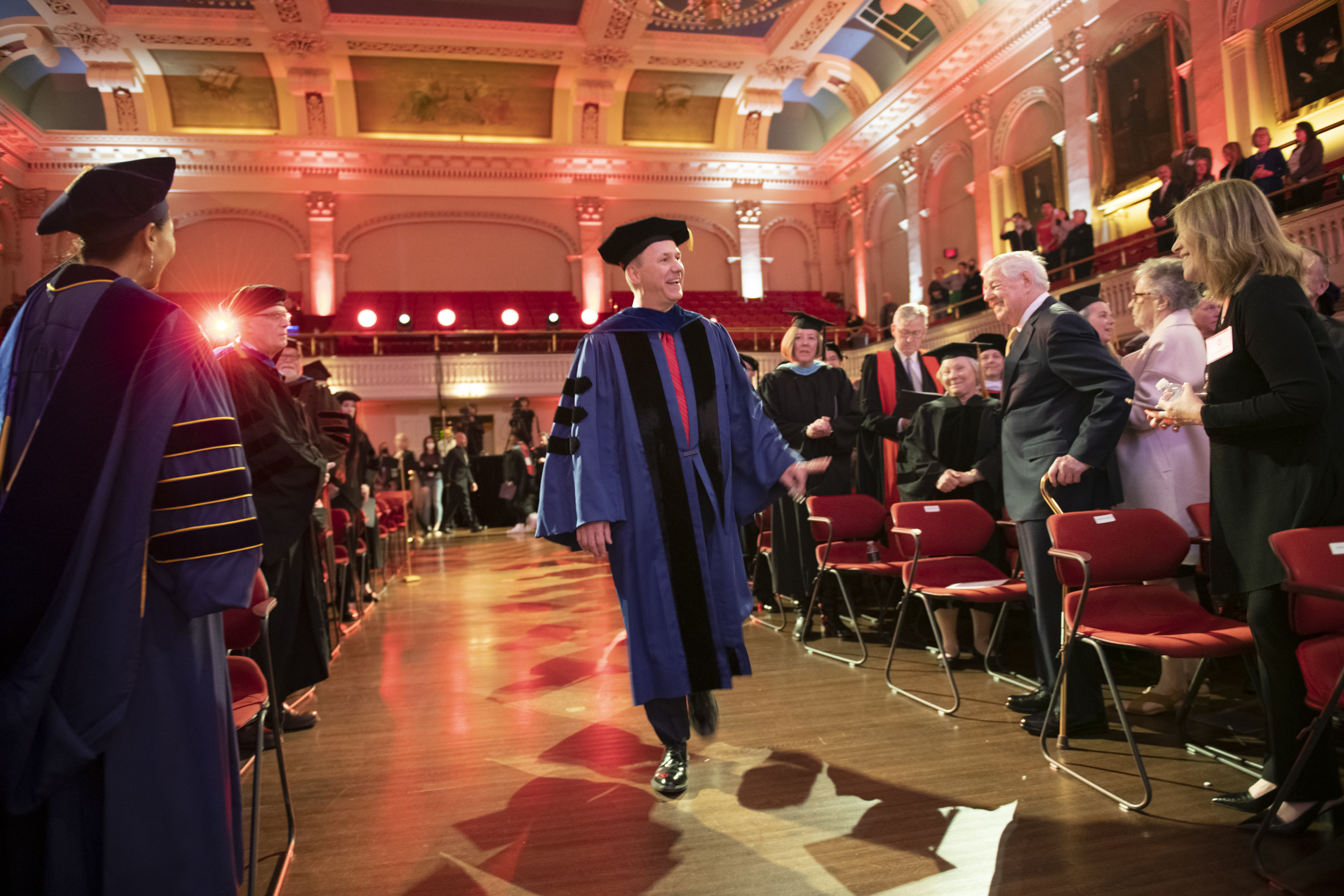 David Fithian walks into the inauguration ceremony in Mechanics Hall