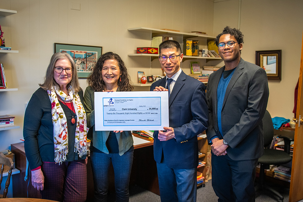 Shinichi Honda presents a check to Yuko Aoyama, associate provost and dean of research and graduate studies, Alice Valentine, professor of Japanese, and Kuy Howard, Japanese language instructor.