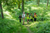 professor and students in woods