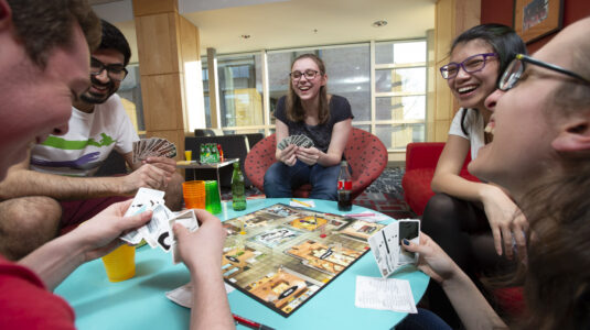 students playing board game