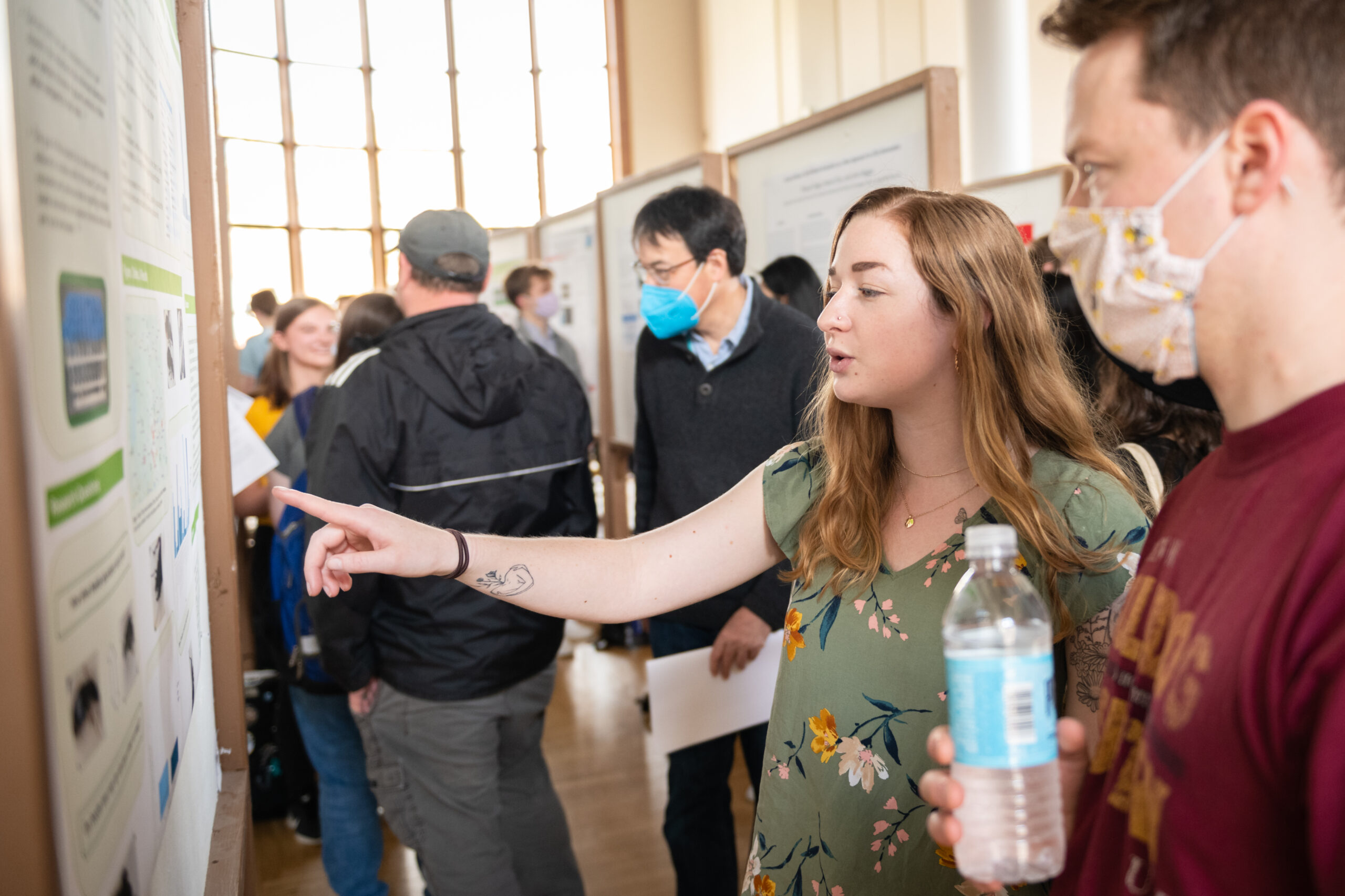 students looking at poster