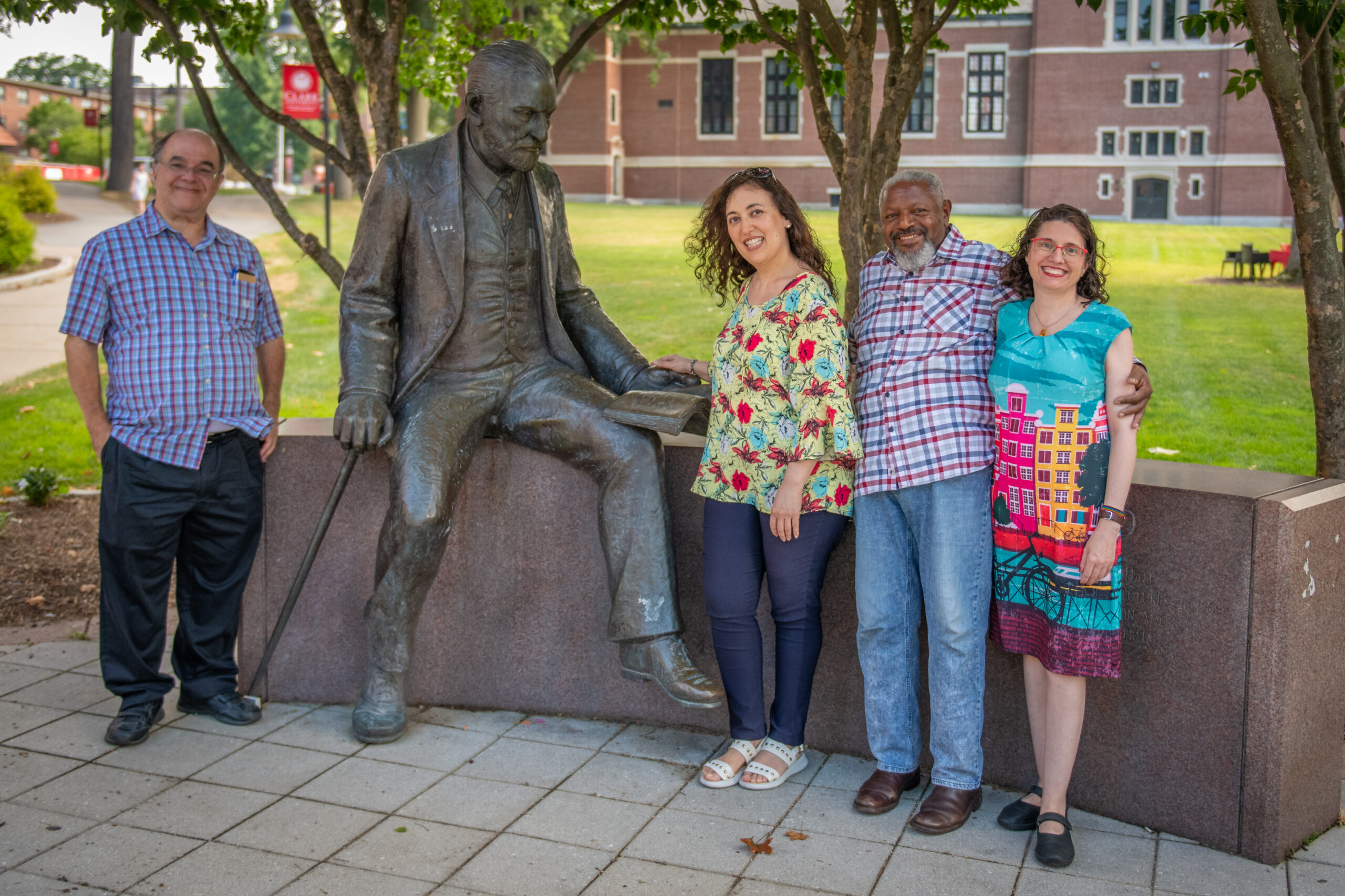 group poses with Freud statue