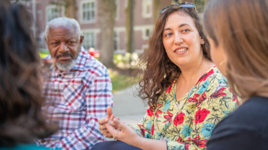 two poets sitting on bench