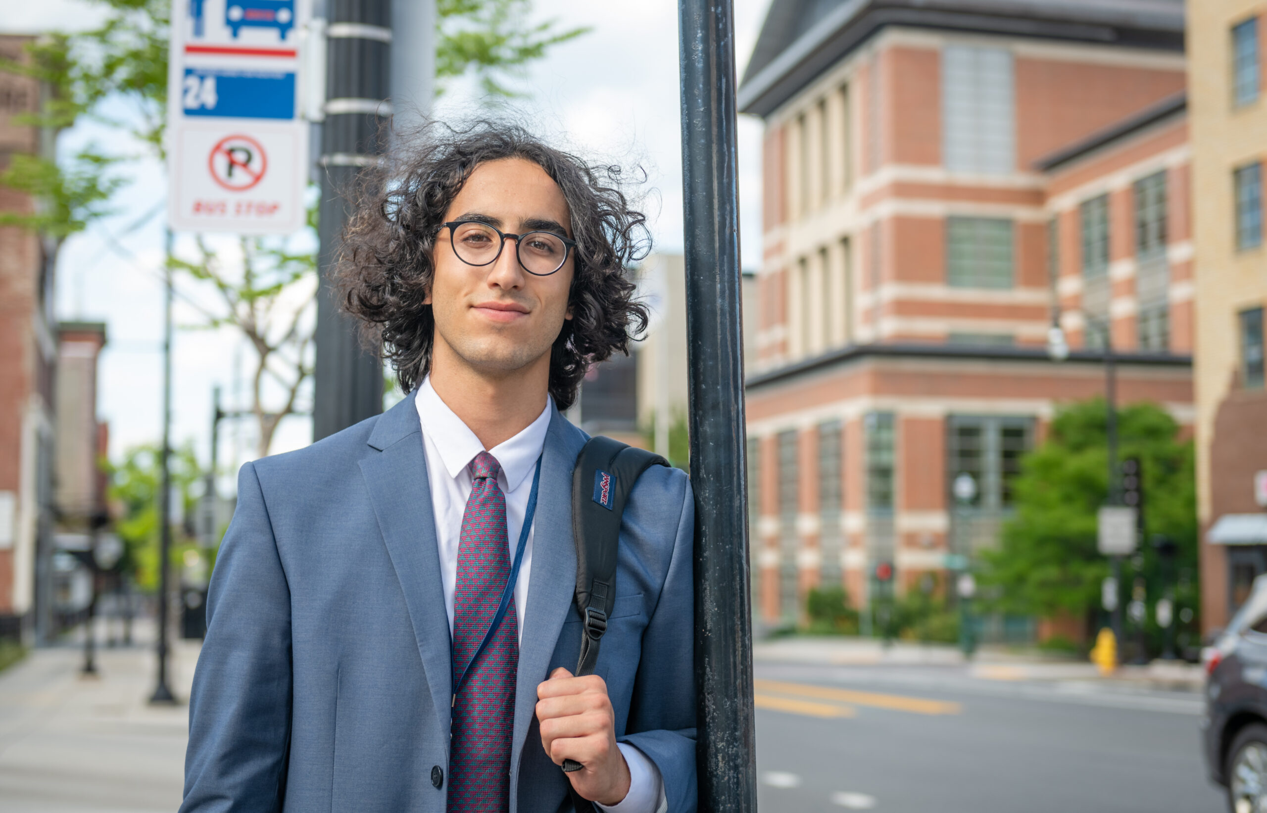 student on street outside courthouse