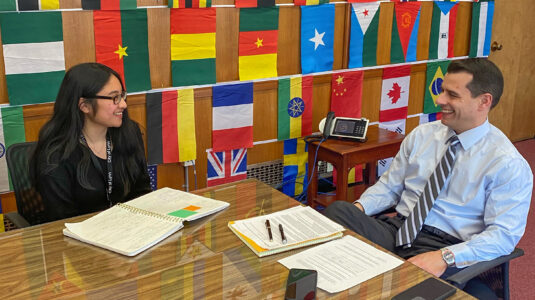 Valerie Vong '22 and Lynn Mayor Jared Nicholson at table