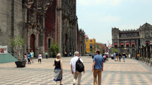 Professors Yelena Ogneva-Himmelberger, Tim Downs, and Morgan Ruelle stroll in front of the Mexico City Metropolitan Cathedral, which had been sinking and in danger of collapse until it was saved by major remedial engineering. Like many structures in Mexico City, the sinking was caused by the over-exploitation of the aquifer, leading to the differential settlement of the cathedral’s foundation.