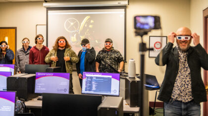 Professor Michael Swartz and students wear 3D glasses