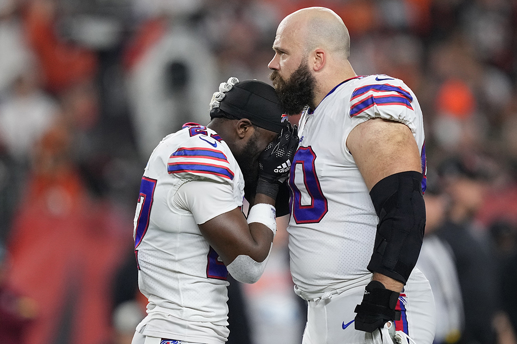 Above: Tre’Davious White and Mitch Morse of the Buffalo Bills react to teammate Damar Hamlin’s collapse during the Jan. 2 game against the Cincinnati Bengals. 