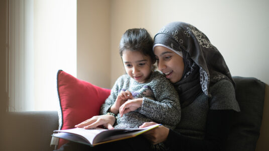 Woman reading to child