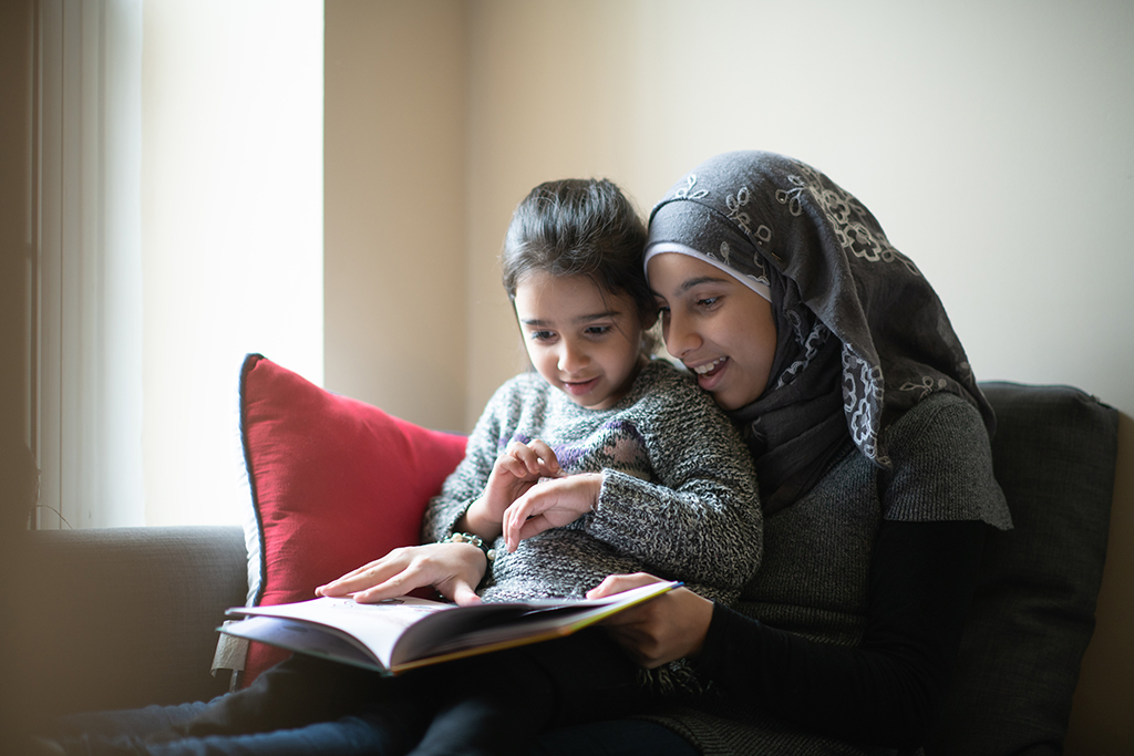 Woman reading to child