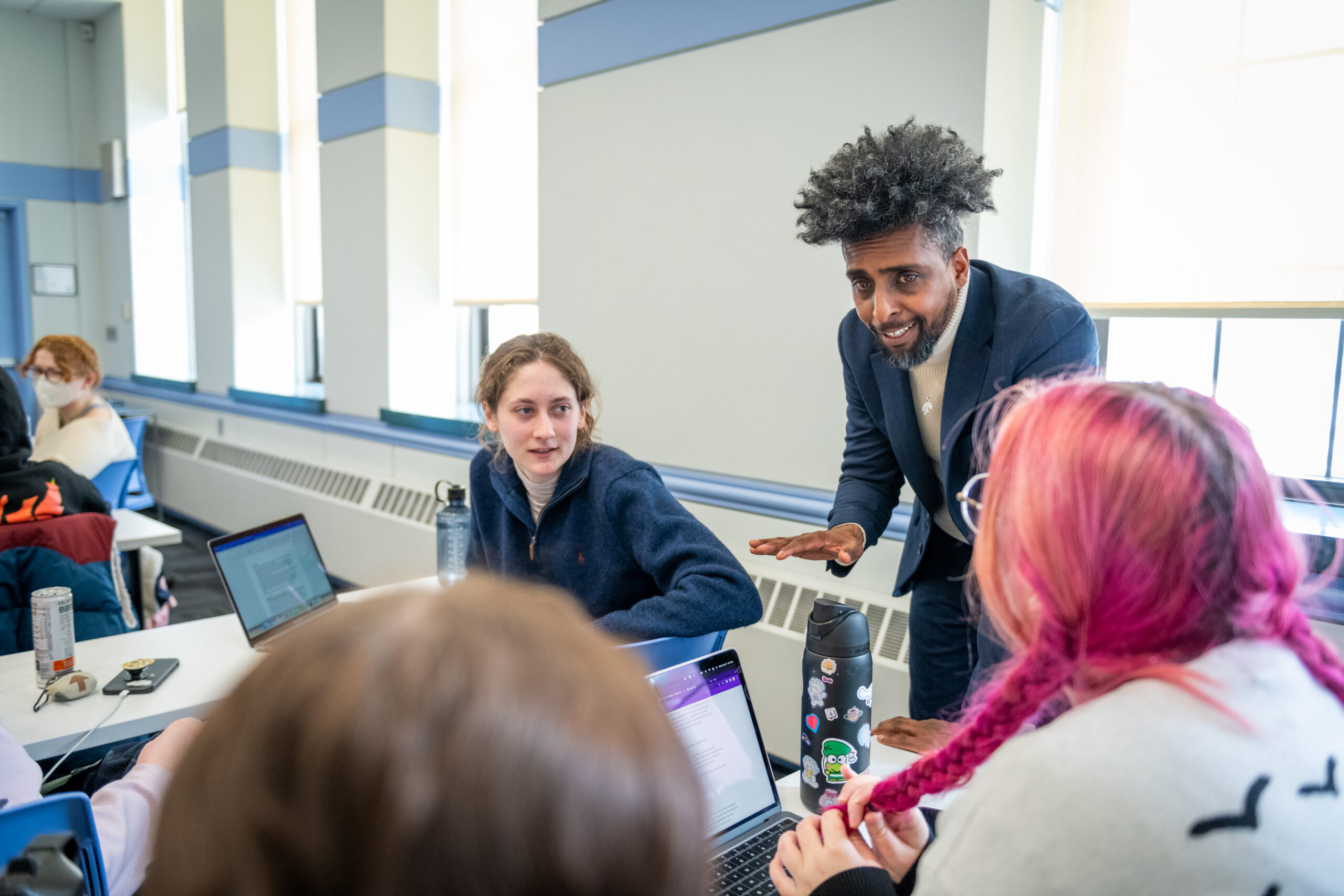 Professor Eduard Arriaga talks to students