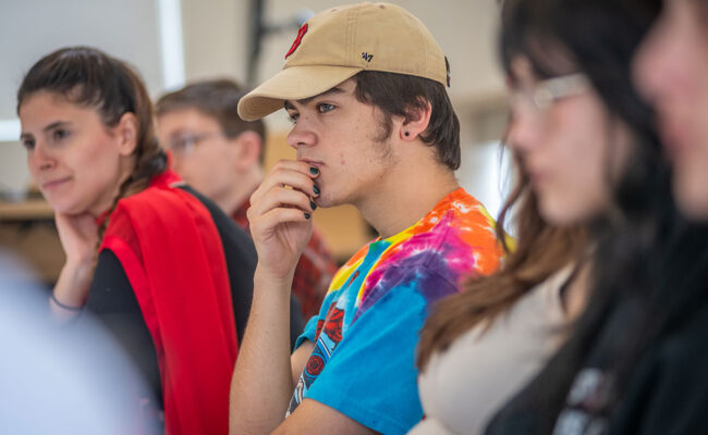 student and faculty in class