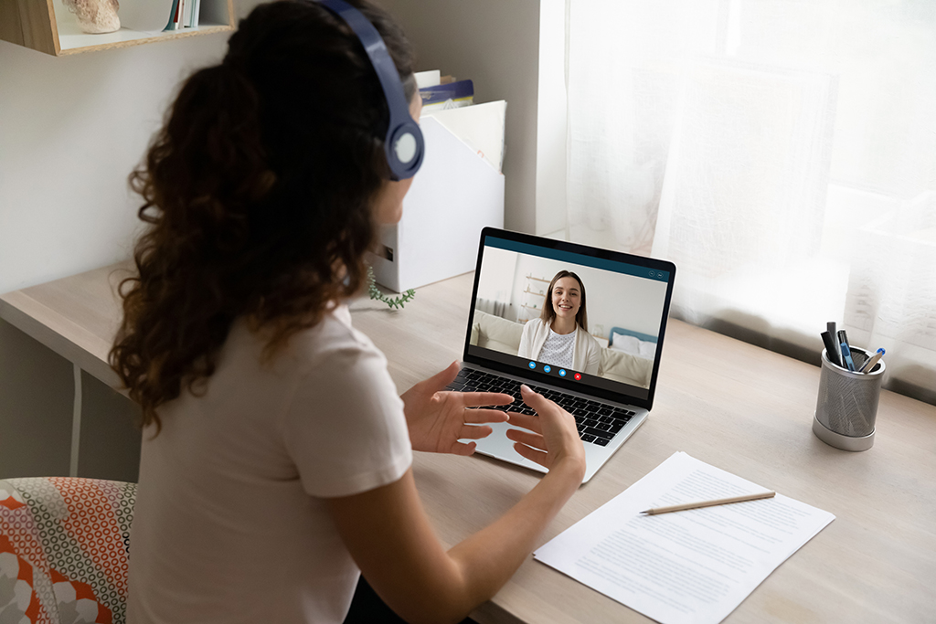 College student at online mental health appointment