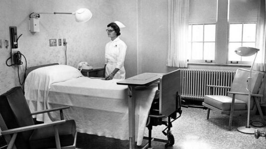 Nurse in 1940s hospital room