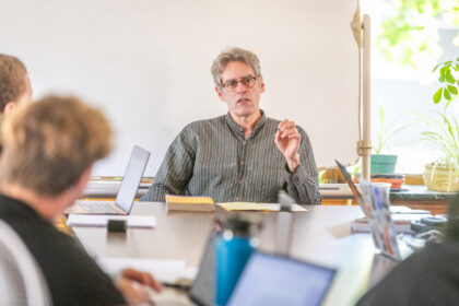 Professor Wes Demarco at table