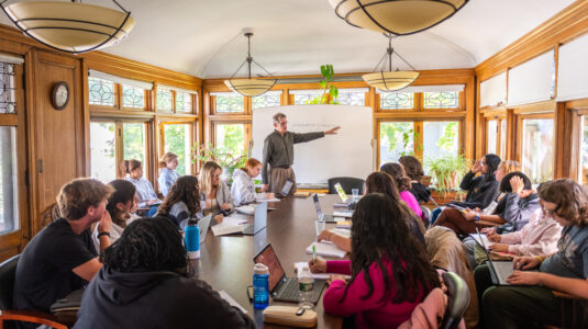 Professor Wes Demarco teaches in classroom.