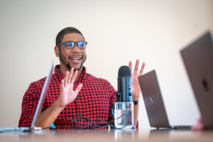 Justin Shaw in front of microphone