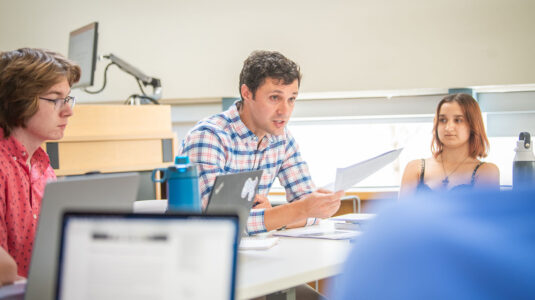 Jack Delehanty in classroom with students