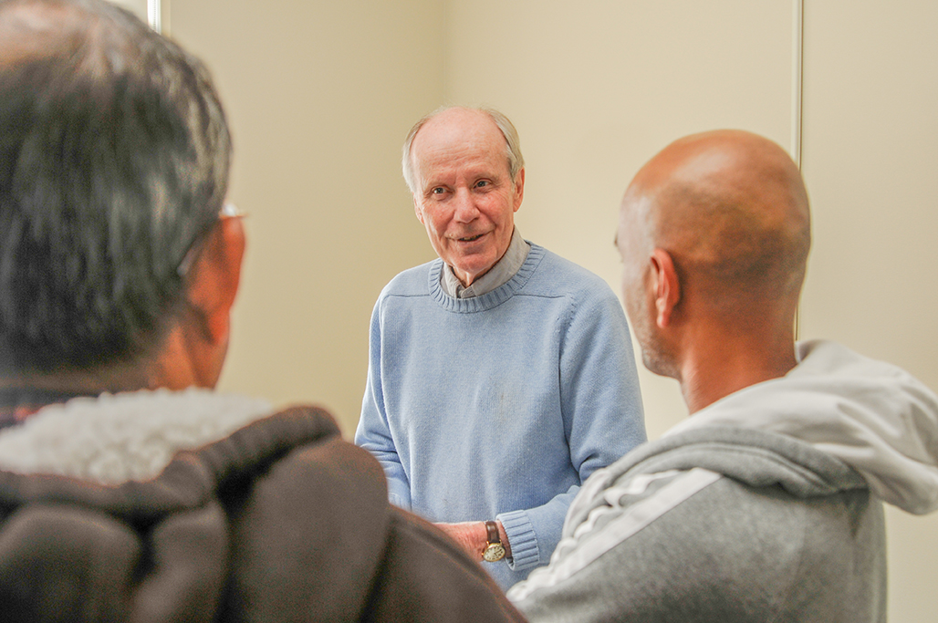 Richard “Dick” Ford speaks with attendees of an International Development, Community, and Environment Department event in 2010.