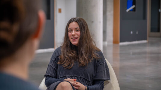 student in chair