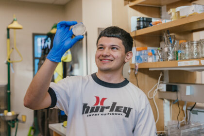 student with Petri dish