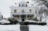 Yellow house in snow