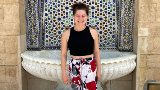 Lia Tang standing in front of fountain