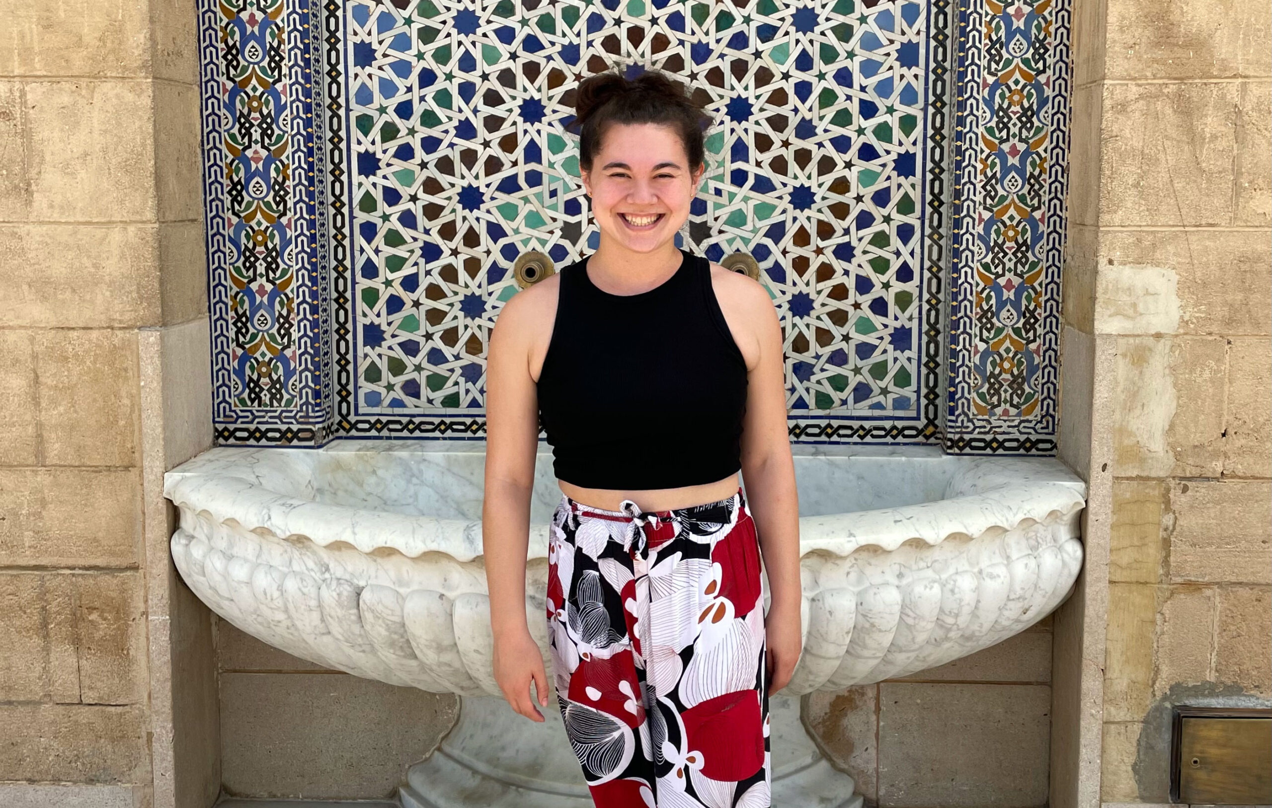 Lia Tang standing in front of fountain