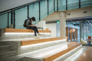 Interior view of an illuminated, staged seating area in the Center for Media Arts, Computing, and Design