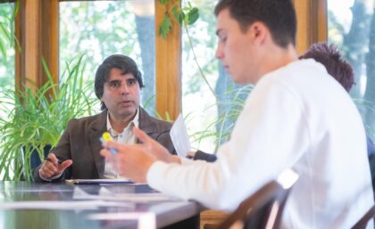 professor and student at table