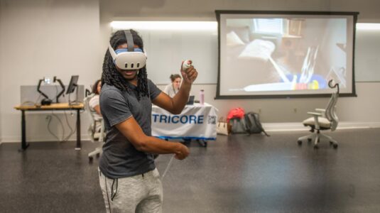 student wearing VR glasses