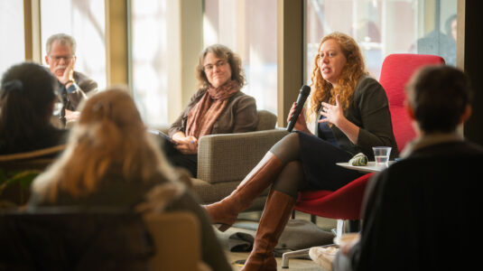 Ora Szekely speaking to audience at library